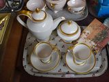 a tray with a tray of tea and coffee cups and saucers