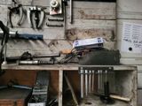 a workbench with tools on it in a garage
