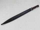 a knife with a wooden handle sitting on top of a table