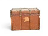 an old suitcase with a tag on it