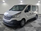the white van is parked in a large room with a checkered floor