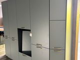 a kitchen with a refrigerator and a stove in it