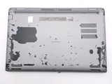 a broken laptop computer sitting on top of a white table
