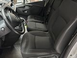the interior of a van with black leather seats and a steering wheel