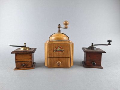 three different types of coffee grinders on a table