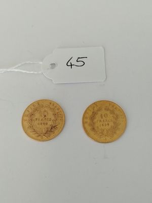 two gold coins with a price tag on them