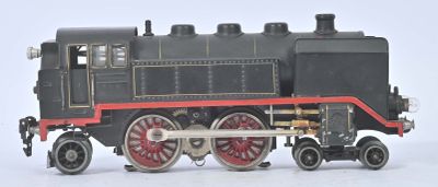 a black and red train engine on a white surface