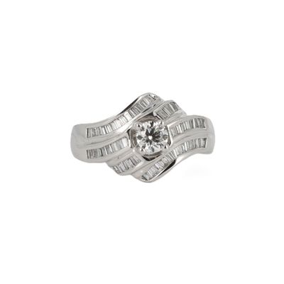 a close up of a diamond ring on a white background