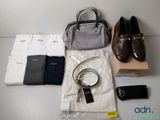 a bag, a purse, a pair of shoes, a belt, and a pair of shoes on a table