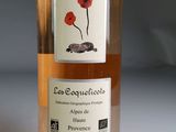 a bottle of wine with a picture of a flower on it