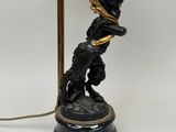an image of a lamp that is on a table with a dog