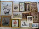 a lot of framed pictures on the wall of a room