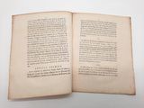 an open book on a white table with a white background