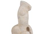 sculpture of a female figure in a seated position on a white background