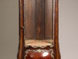 an old wooden chair with a wooden seat on it