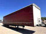 a semi trailer that is parked in a parking lot