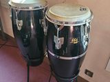 two congas sitting next to each other in a room