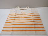 an orange and white striped tote bag with a name on it