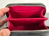 a person holding an empty wallet in their hand
