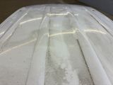 a close up of a car ' s hood with a lot of dirt on it