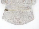 a stone object on a white surface with a white background