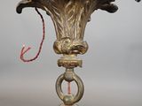 a glass vase with a gold decoration on top of it