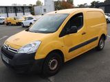yellow citrole van parked in a parking lot with other cars in the background