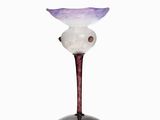 a glass vase that is sitting on a table