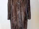 an image of a fur coat on a mannequin stand