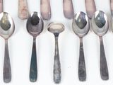 a lot of spoons and spoon spoons on the table
