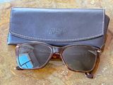 a pair of sunglasses and a case on a table