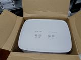a box that has a white device inside of it