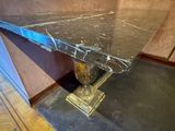 a marble table with a vase on top of it