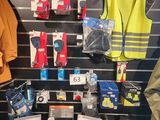 many items on display in a store that include safety vests and safety vests