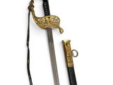 a close up of a sword on a white surface with a black handle
