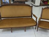 two chairs and a couch in a room with a lot of furniture