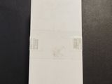 a close up of a piece of paper sitting on a table next to a pair of scissors