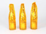 three yellow vases sitting next to each other on a white surface
