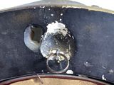 a close up of a piece of wood with a ring on it