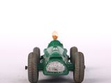 a green toy car with a yellow top on a white surface