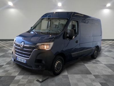 a picture of a blue van parked in a garage