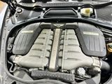 the engine of a car with its hood open and the hood down