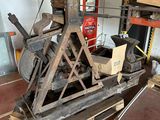 a machine that is sitting on a pallet in a garage