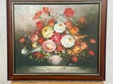 a picture of a painting on an easel with flowers in it