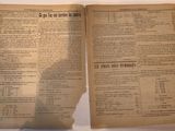 two pages of a book on a white table with a shadow of a person