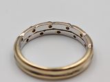 a close up of a ring and a cigarette on a table