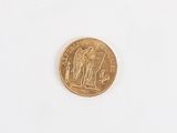 a gold coin with a picture of an angel on it