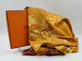 a book sitting on top of a pile of folded fabric