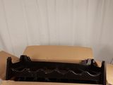 an open cardboard box sitting on top of a table next to a white wall