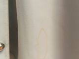 a close up of a white shirt with buttons on it